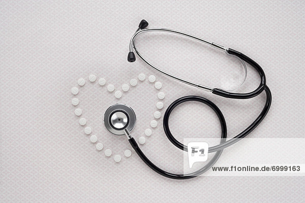 Pills in Heart Shape and Stethoscope