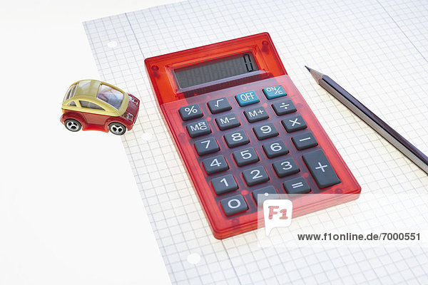 Calculator  Pen  Graph Paper and Toy Car