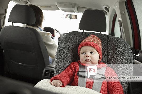 Baby in Car Seat with Mother Driving