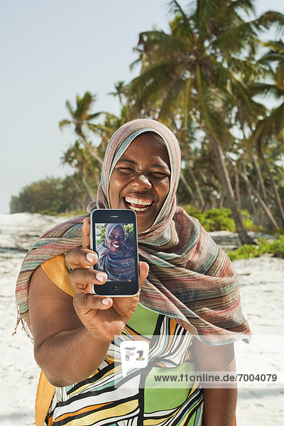 Woman Showing Snapshots  Nyota Beach  Unguja  Zanzibar  Tanzania