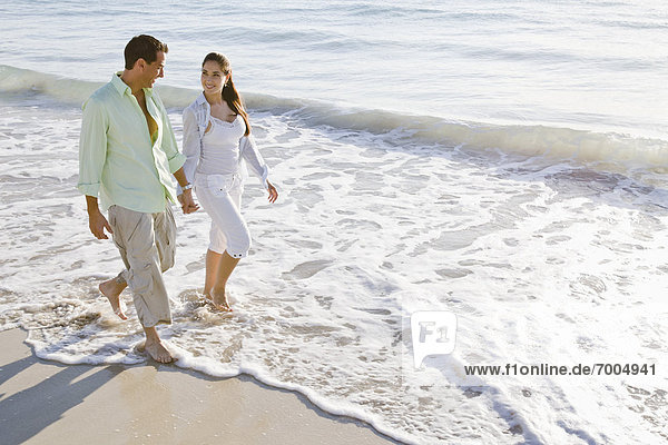 Couple Walking on Beach