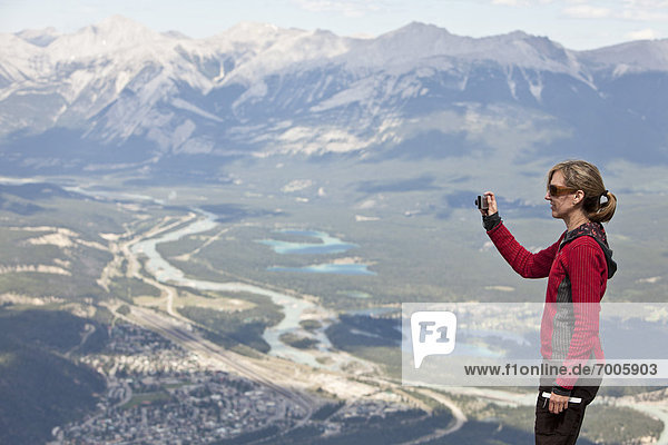 Woman taking Photo  Whistlers Mountain  Jasper National Park  Alberta  Canada