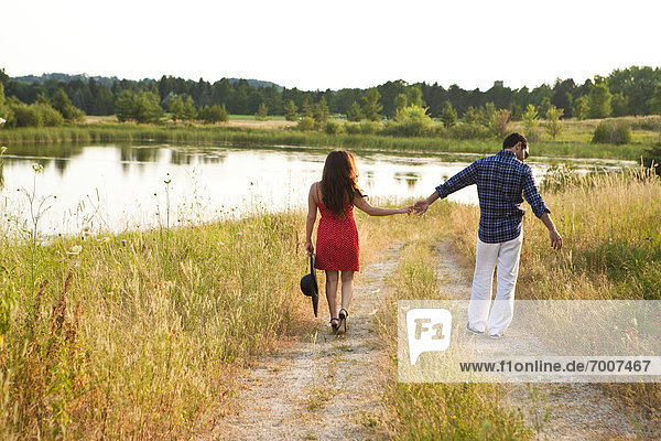 Couple Walking by Pond  Unionville  Ontario  Canada