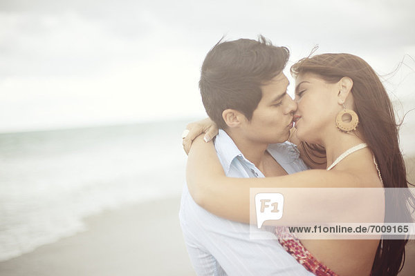 Couple Kissing at Beach  Jupiter  Palm Beach County  Florida  USA
