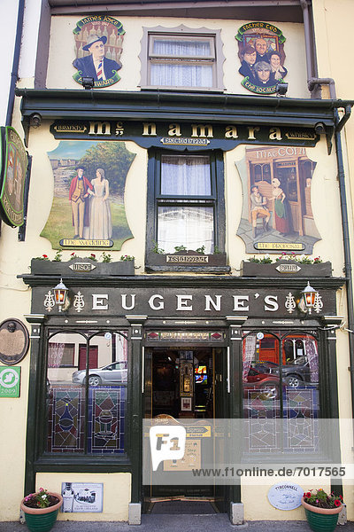 'Pictures and stained glass windows on the front of eugene's pub