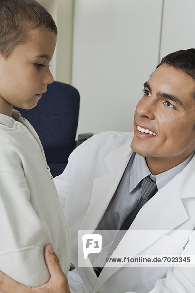 Doctor smiling at little boy
