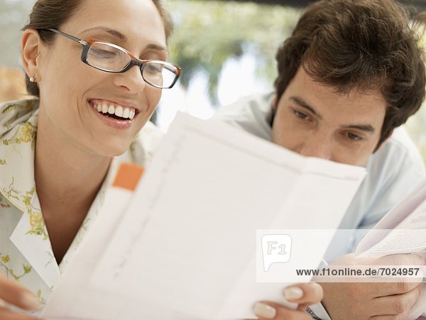 Young couple looking at bills