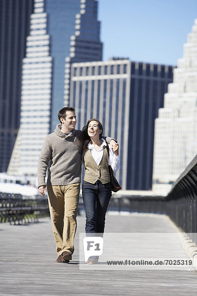 Couple walking on bridge  New York City  New York  USA