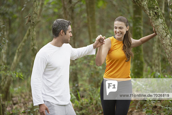 Couple jogging in forest