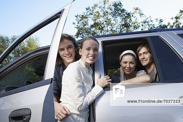 Two young couples in car (portrait  low angle view)