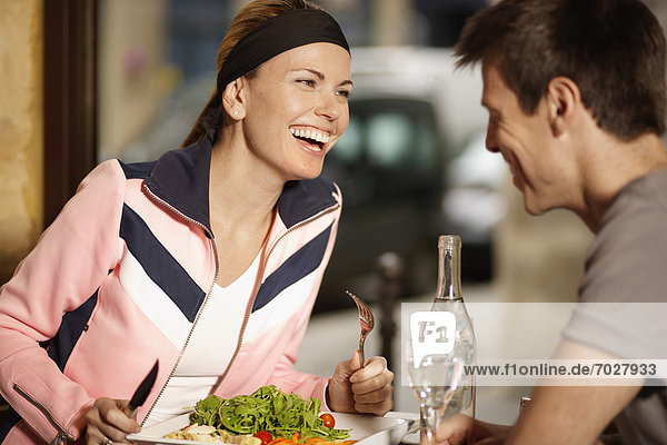 Mid adult couple having lunch in restaurant