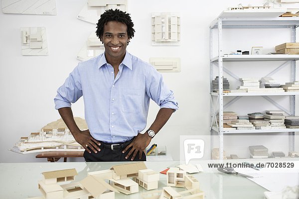 Architect with models of houses (portrait)