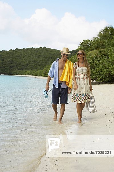 Mid adult couple walking on sandy beach  St. John  US Virgin Islands  USA