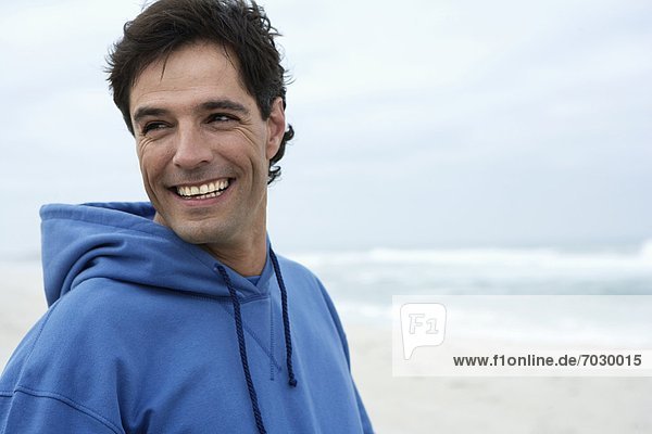 Portrait of mid adult man on beach