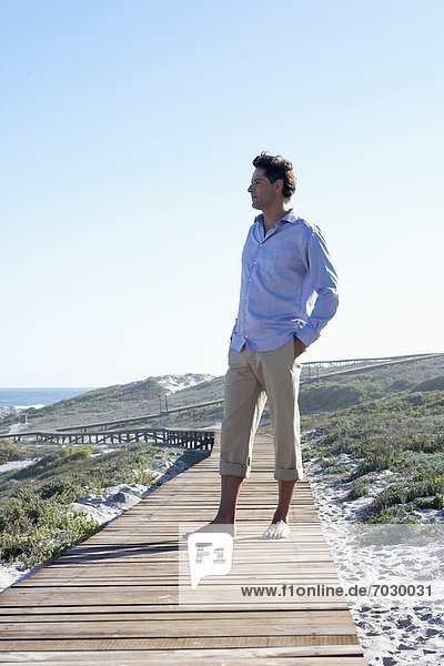 Mid adult man looking at view at coast  Cape Town  South Africa