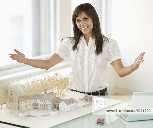 Mid-Adult Woman With Architectural Model