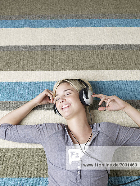 Young Woman Listening to Headphones