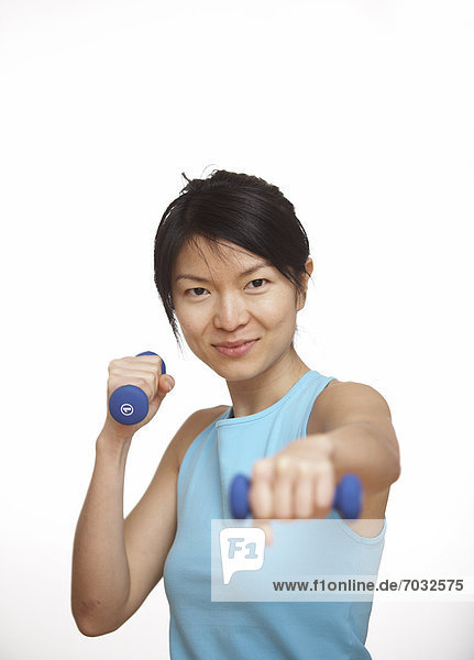 Mid-Adult Woman Working Out with Dumbbells