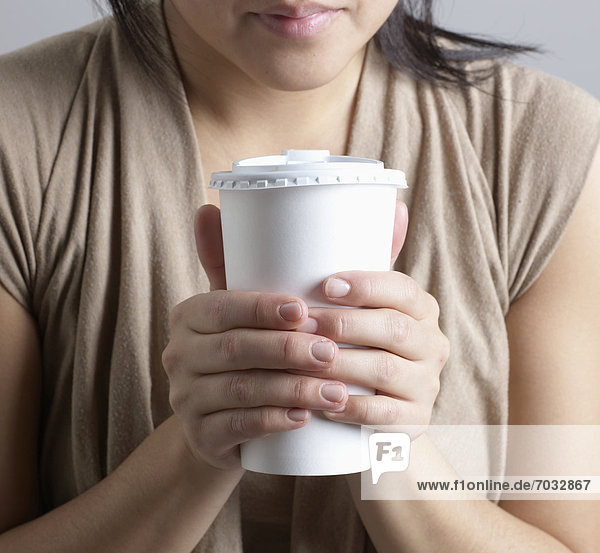 Close-Up of Woman Holding Takeout Coffee