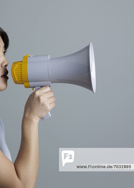 Mid-Adult Woman Using Megaphone