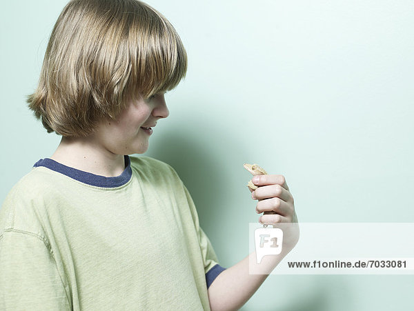 Boy Holding Lizard in Hand