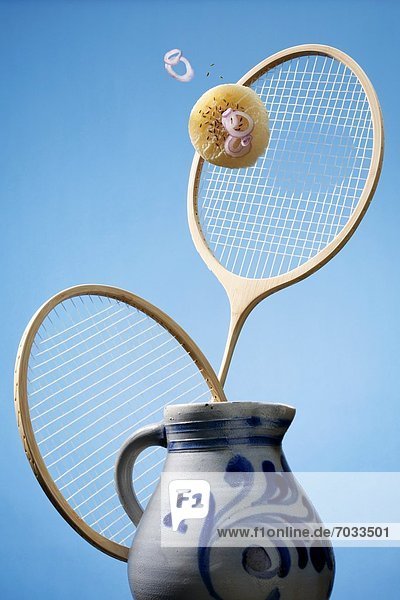 Flying handkaese with badminton racket and jug