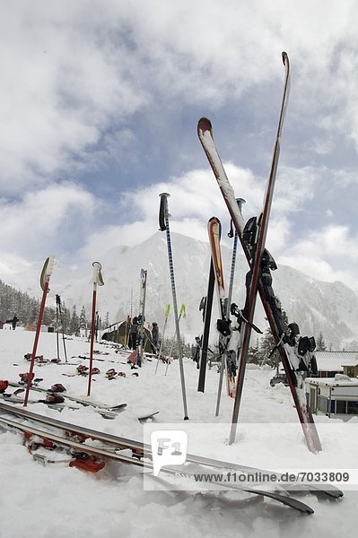 Skiis And Ski Poles In Snow
