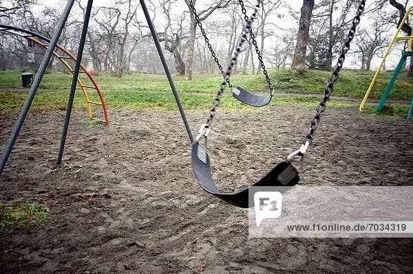 Empty Swings In Playground