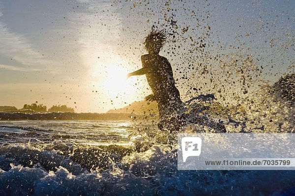 Person Skimboarding