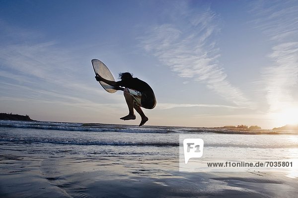 Person Skimboarding