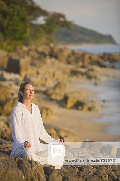 Woman Meditating On A Beach  Ko Lanta  Thailand