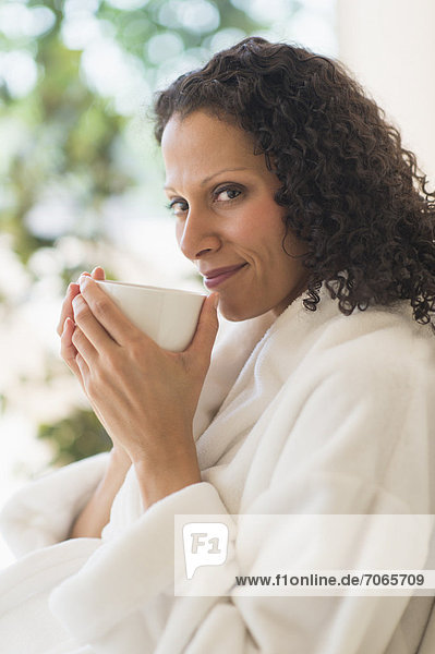 Woman relaxing with cup of coffee