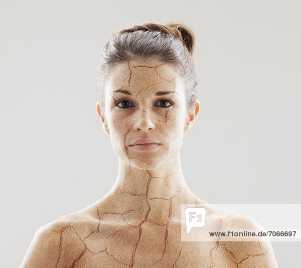 Head and shoulders shot of woman with cracked skin