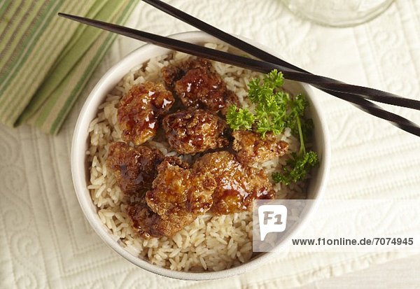 Orange Chicken Over Rice with Chopsticks