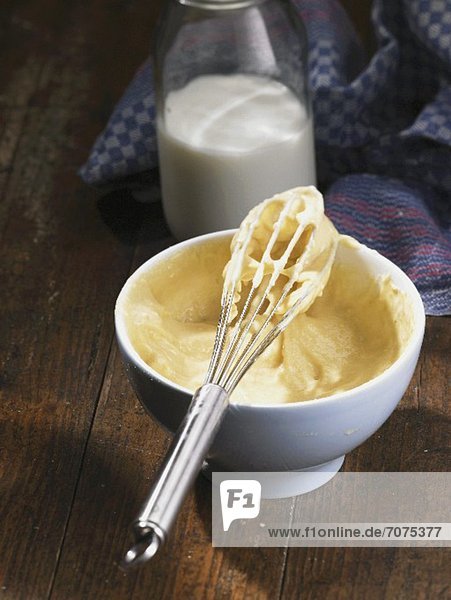 A bowl of potato flour dough with a whisk