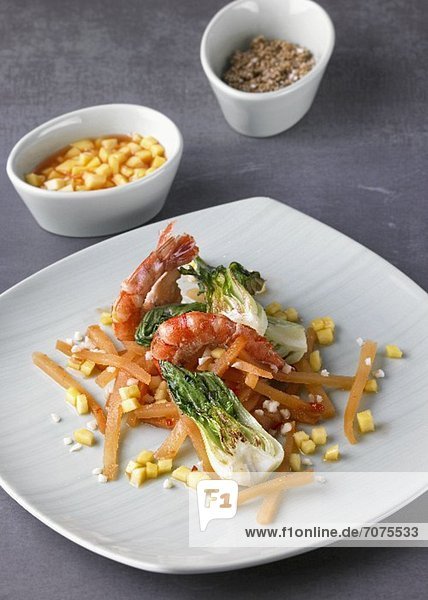 Sauteed prawns with carrots  bok choy and diced mango