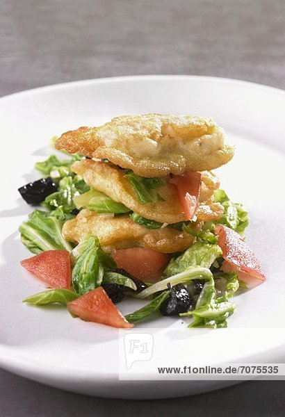 Baked monk fish with bok choy  tomatoes and olives