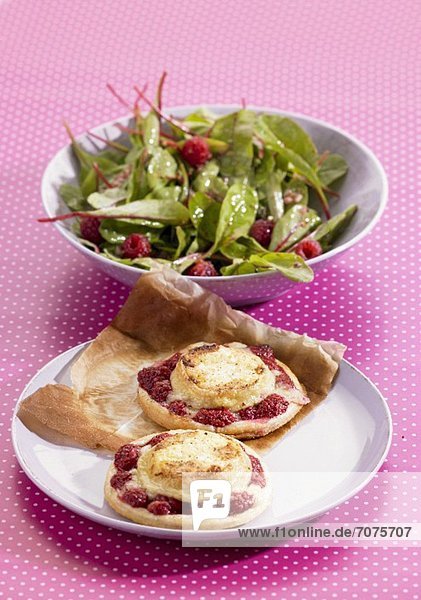 Goat's cheese and raspberry tartlets and a side salad