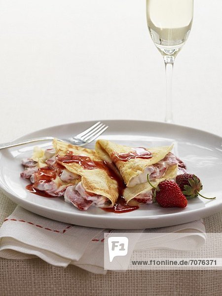 Strawberry crepes with strawberry syrup