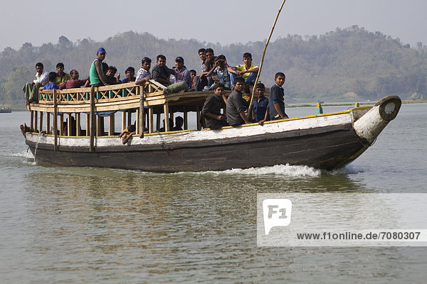 People sitting on the roof of a ferry boat  Kaptai Lake  Rangamati  Chittagong Hill Tracts  Bangladesh  South Asia  Asia