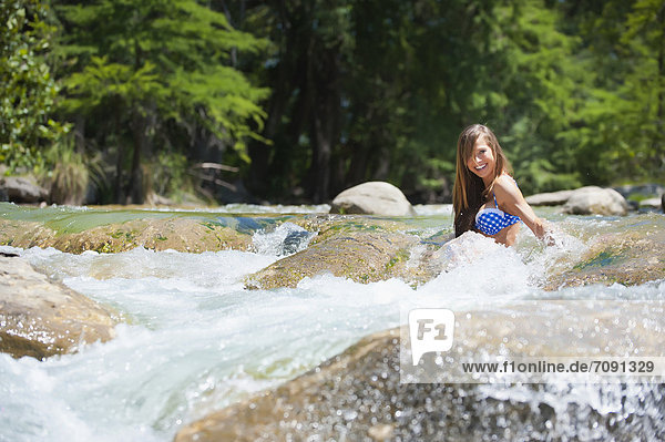 USA  Texas  Young woman enjoying in Frio river