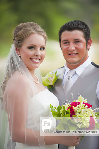 USA  Texas  Bride and groom smiling  portrait