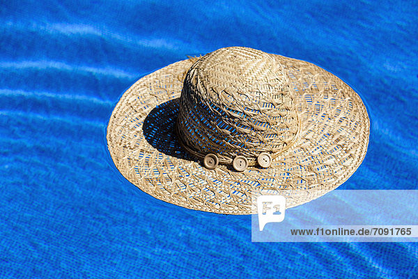 Austria  Linz  Sun hat floating in swimming pool