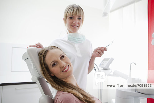 Germany  Dentist and patient  smiling  portrait
