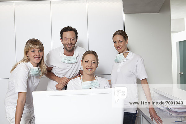 Germany  Dentist and assistance smiling  portrait