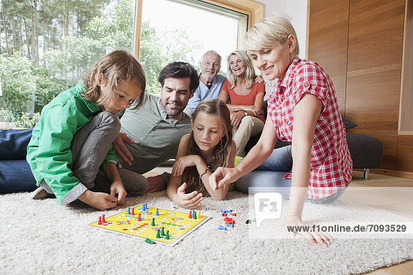 Germany  Bavaria  Nuremberg  Family playing board game together