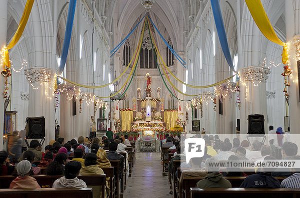 Inside St. Philomenas Cathedral at Christmas Eve in Mysore  India  Asia
