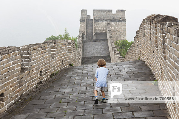 China  boy walking on Great Wall of China