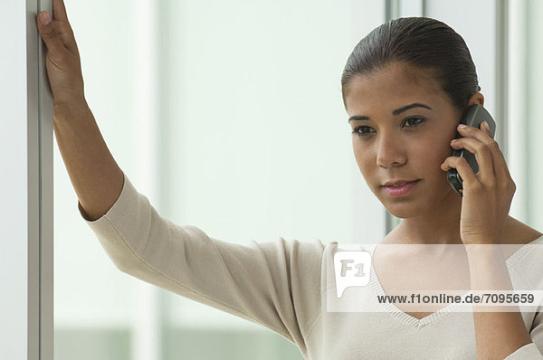 Young woman talking on cell phone