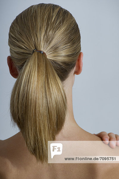 Woman with ponytail  rear view